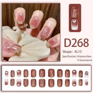 Uñas postizas mármol rosa marrón con corazones de purpurina plateada en set de 24