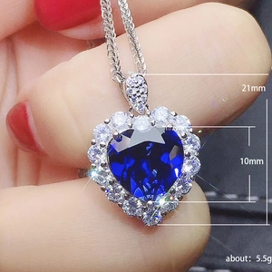 Elegant silver necklace with 10mm blue heart pendant and 21mm sparkling crystal halo