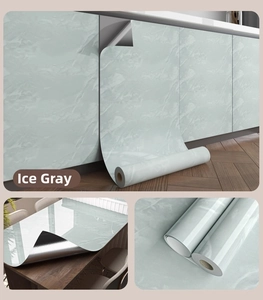 Close-up of gray marble self-adhesive wallpaper with heat-resistant aluminum backing
