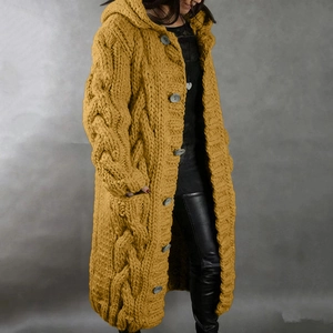 Detail of ginger yellow cable knit cardigan with large buttons and side pockets