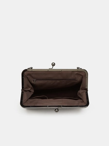 Detail of the vintage frame bag interior with coffee fabric lining and metal clasp lock