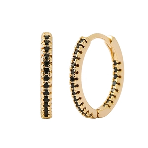 Close-up of gold hoop earrings with black zircon pave setting on white background