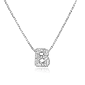 Macro detail of silver letter B pendant with cubic zirconia stones on box chain