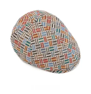 Top view of retro flat cap featuring colorful jacquard plaid texture and woven fabric