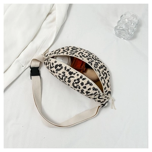 Detailed top view of a beige leopard print woven waist bag showing its spacious capacity