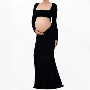 Black two-piece maternity set featuring long sleeve crop top and bodycon maxi skirt