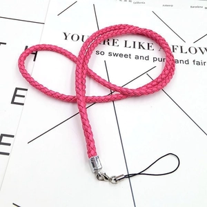 Close-up of rose red braided strap with silver lobster clasp and metal fixings