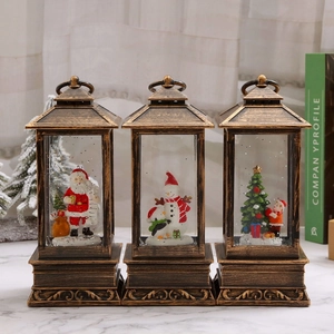 Three bronze Christmas lanterns with internal glitter water and festive snow scenes