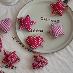 Handmade fabric heart and star Christmas ornaments with rustic jute hanging ropes