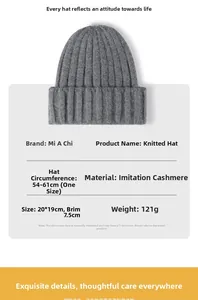 Detail showing grey knit beanie specifications: faux cashmere material, 121g weight, 20x19cm size