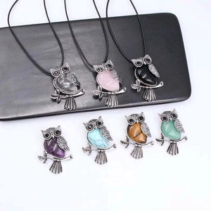Handcrafted owl crystal pendants in various natural gemstones with silver metal finish