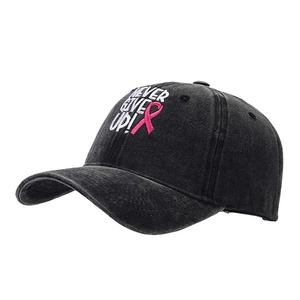Washed cotton baseball cap featuring pink ribbon embroidery and Never Give Up text