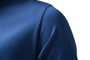 Detail view of reinforced shoulder seams and dense knit texture on navy cotton t-shirt