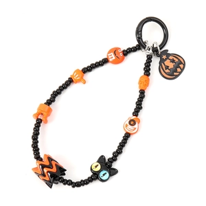 Beaded Halloween wristlet keychain with orange smile charm and black beads