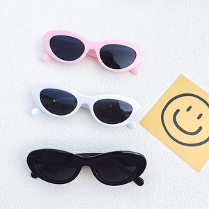 Stylish oval cat-eye sunglasses in pink, white, and black for women with UV protection
