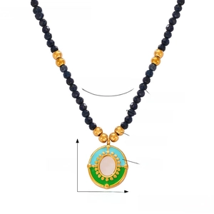 Bohemian natural stone beaded necklace with titanium steel oil drop pendant detail view.
