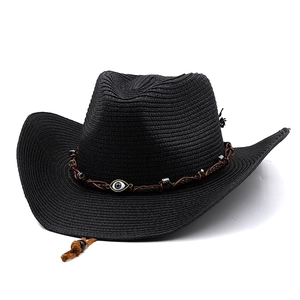 Close-up of black straw cowboy hat featuring blue evil eye charm and woven band details