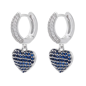 Macro shot of silver heart hoop earrings with blue and clear pavé-set stones
