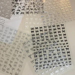Elegant bowknot nail art stickers set in gold, silver, black, and white colors