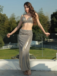 Deep V-neck halter top and high-waist maxi skirt set with silver metallic shine and jewels