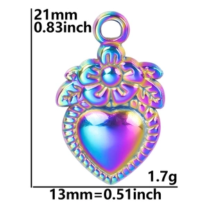 Macro view of rainbow stainless steel heart pendant with floral engraving and dimensions