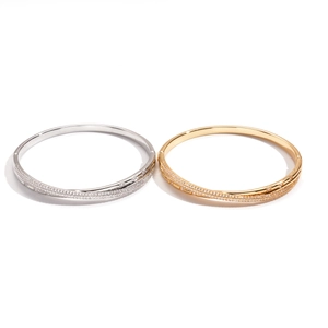 18k gold plated bangle with cubic zirconia pave cross buckle design in gold and silver