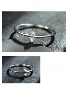 Close-up of minimalist S925 silver ring featuring vertically set twin cubic zirconia