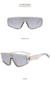 Macro detail of silver mirrored oversized shield sunglasses with a golden star decor