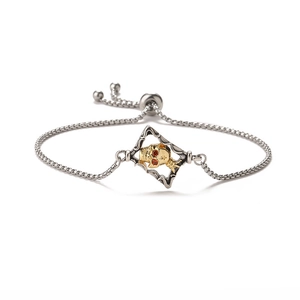 Adjustable evil eye skull bracelet with zircon eyes and two-tone metal finish