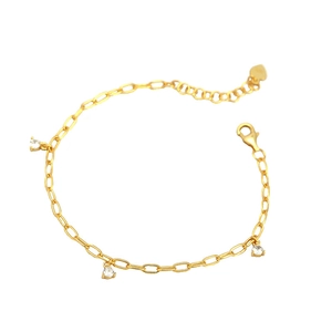 Gold paperclip chain bracelet with three clear zircon charms and heart tag detail
