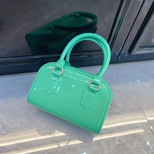 Minimalist green jelly Boston handbag with gold hardware and double handles for women