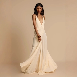 Elegant beige deep V-neck maxi dress featuring lace patchwork and flowing chiffon skirt