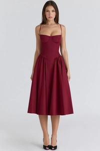 Close-up detail of burgundy corset-style bodice with structured cups and thin straps