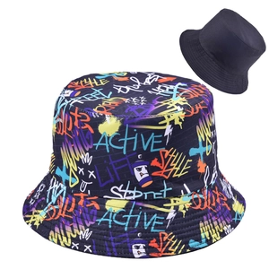 Detail showing graffiti print and plain reversible cotton bucket hat designs