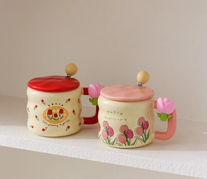 Detail of Korean-style tulip ceramic mugs with creative handles and matching lids