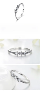 Detailed view of S925 sterling silver ring featuring three inlaid 0.4cm sparkly stars