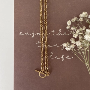925 silver pearl chain necklace with gold OT toggle clasp on a dark matte background