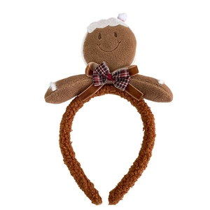 Plush brown gingerbread man headband with red plaid bow and 3D cartoon Christmas design