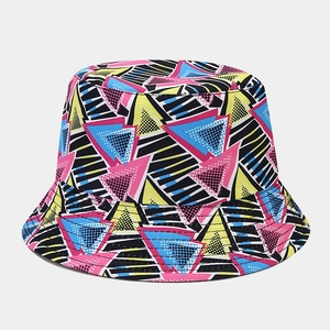 Close-up of reversible bucket hat with 90s vintage geometric patterns and pink triangle prints