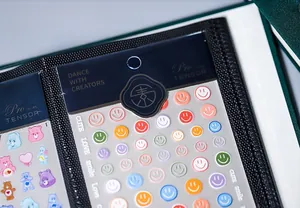 Close-up of a large capacity nail sticker storage book with clear pockets and black lining
