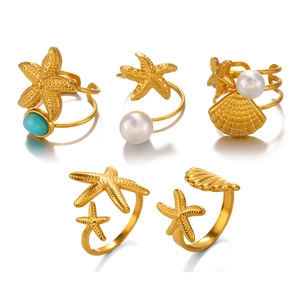 Five-piece gold ocean ring set with starfish, seashell, pearl and turquoise elements
