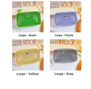 Large mesh organizers in green, purple, yellow, and grey with cute eye patterns