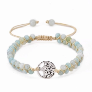 Detail of double-layer turquoise beaded bracelet with silver Tree of Life charm and knot