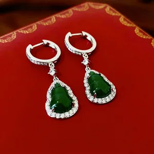 Gourd-shaped dark green pendant necklace with zircon inlay in a red jewelry box