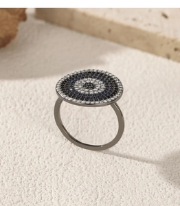 Detailed view of luxury S925 silver evil eye ring with blue and clear pave crystals