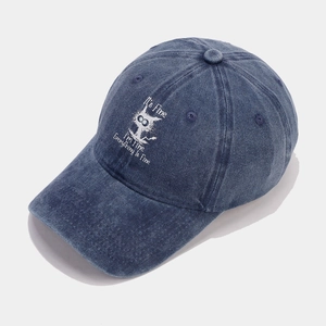 Detailed embroidery on vintage washed denim baseball cap with distressed cat graphic