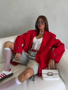 Oversized red blazer with silver heart-shaped buttons and white lace bodice styling