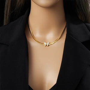 Gold butterfly pendant necklace with white shell inlay on flat snake blade chain