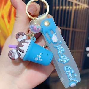 Blue ice cream cup keychain with chocolate donut charm and beaded strap detail