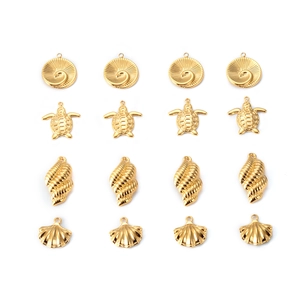 Macro shot of 16 gold ocean charms including turtles and shells for DIY jewelry making